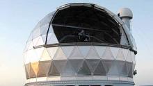 The Hobby-Eberly Telescope enclosure, with its dome open for observing and louve