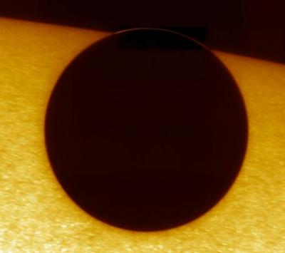 A view of the 2004 transit; the Venus limb outside the Sun has been enhanced.