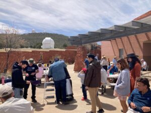 People looking through telescopes