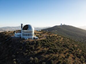 Three large telescopes in the mountains of West Texas.