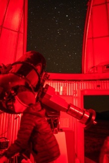 A visitor observes through the 16" Ritchey-Chretien at the Frank N. Bash Visitors Center during a public star party.