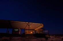 Big Bend Stargazer trailer under awning with nigh-sky friendly lights in Terlingua, Texas. photo by Stephen Hummel / McDonald Observatory.