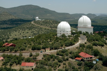 Aerial view of the large telescope domes of McDonald Observatory.