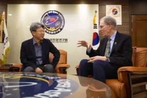 Two men talking in a room